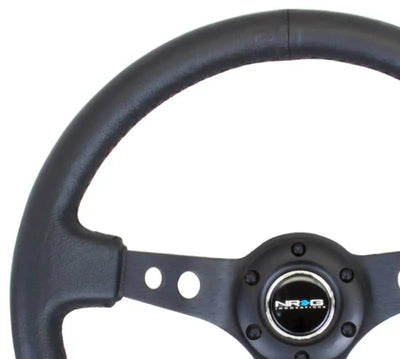NRG Reinforced Steering Wheel (350mm / 3in. Deep) Blk Leather w/Blk Spoke & Circle Cutouts 