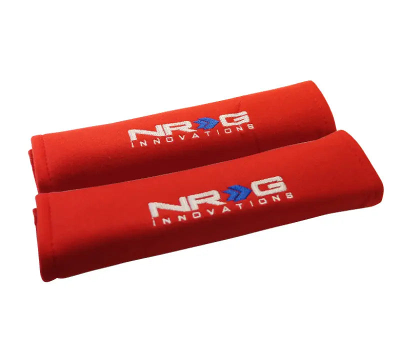 Red seat belt pads for comfortable driving, part of NRG Seat Belt Pads 2.7x11in set