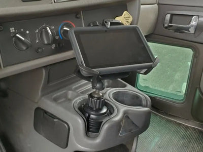 Tablet mounted in a vehicle’s cup holder using Havis Cup Holder for 7-9 inch devices