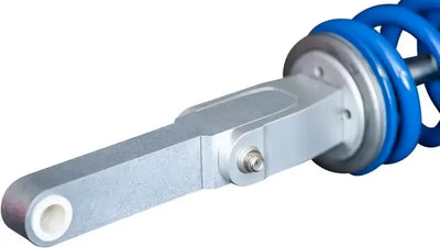 Blue coiled spring and silver shock absorber from Rale Industries Suz Fit Kit