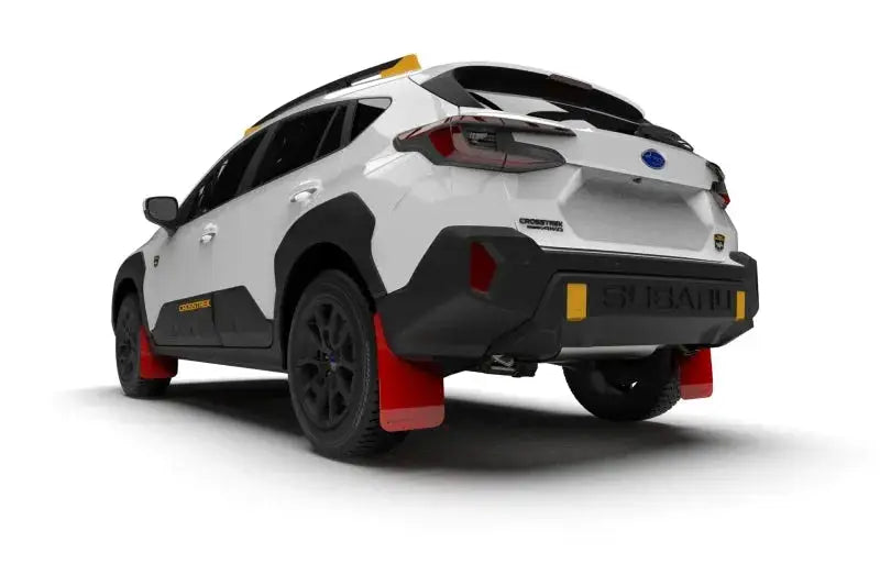 White Subaru Crosstrek SUV with red UR mud flaps by Rally Armor