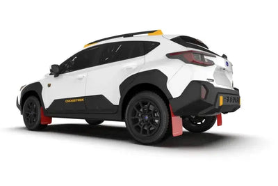 White and black Subaru Crosstrek with Rally Armor red UR mud flaps