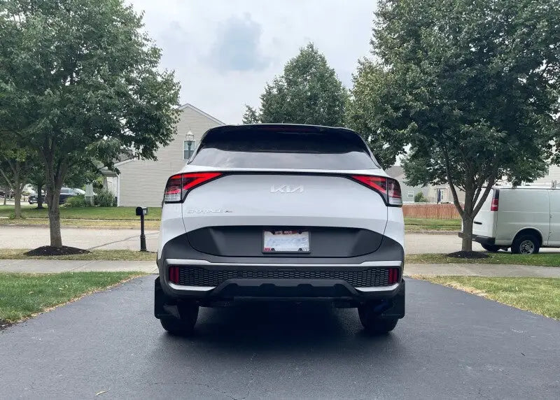 White 2023 Kia Sorento SUV with black accents, urethane mud flaps