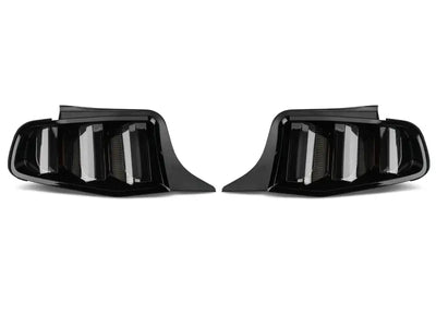 Pair of dark automotive tail lights showing Raxiom Vector V2 LED Tail Lights for Ford Mustang