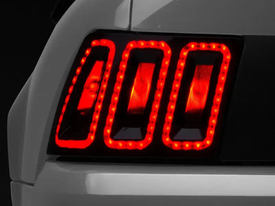 Raxiom 99-04 Ford Mustang Excluding 99-01 Cobra Icon LED Tail Lights- Black Housing (Smoked Lens) - Truck & Automotive
