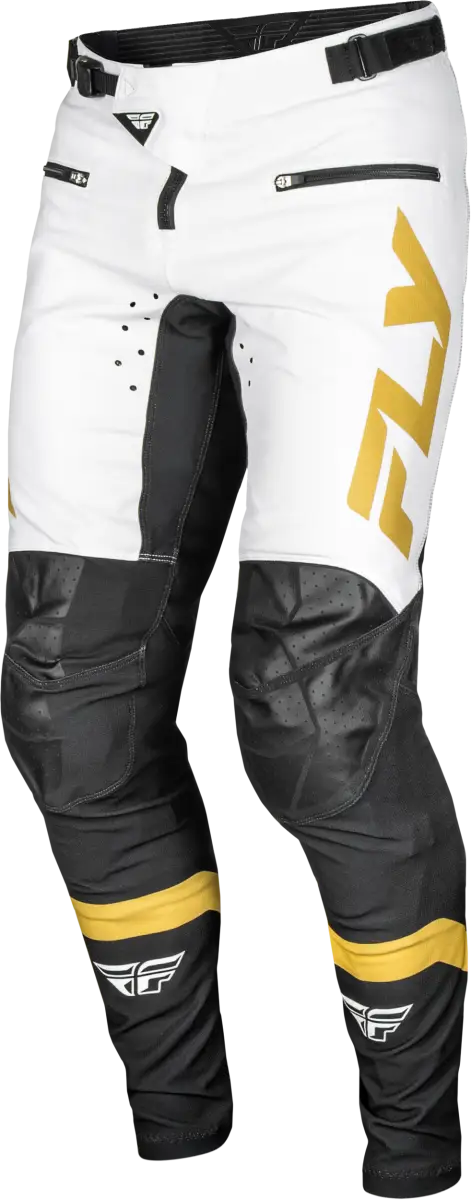 White and black motocross pants with yellow accents featuring durable stretch technology