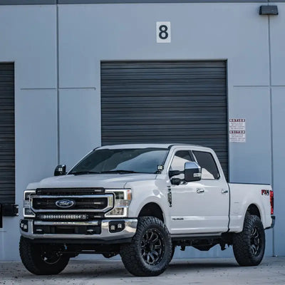 White 2020+ Ford Super Duty featuring a Rigid Industries RIG Bumper Mount with RDS Series light bar.