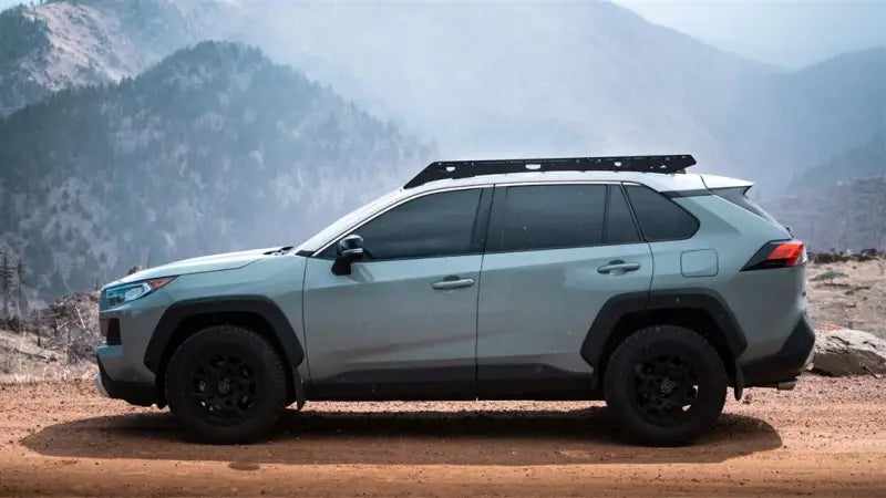 Gray SUV with black anodized roof rack featuring direct fit, aluminum build, and accessories