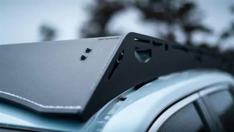 Black anodized roof rack with direct fit, crossbars, mounting hardware, and fairing