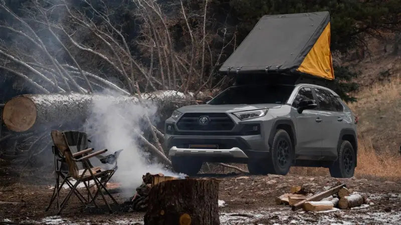 Gray SUV with black anodized roof rack and rooftop tent for adventure ready setups