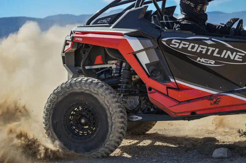 Red and black off-road vehicle with Daystar HCR Suspension for rugged adventures