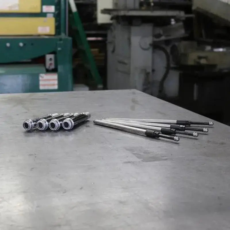 Metal pushrods and hollow tubes.