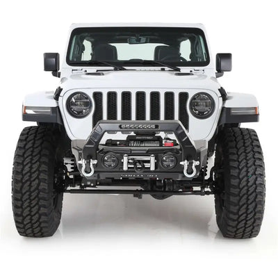 White Jeep Wrangler with aftermarket bumper featuring Smittybilt 97-06 Wrgl door skin