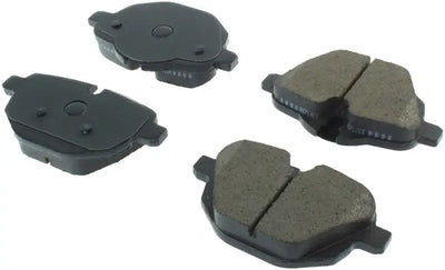 Four dark grey and black StopTech Street Brake Pads for rear brake system