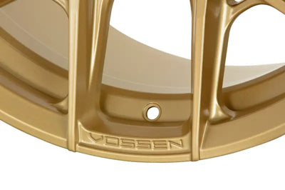 Glossy Vossen HF6-4 satin gold wheel with intricate design