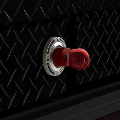 Red Weatherguard 70171R series lock core key in silver lock on diamond plate