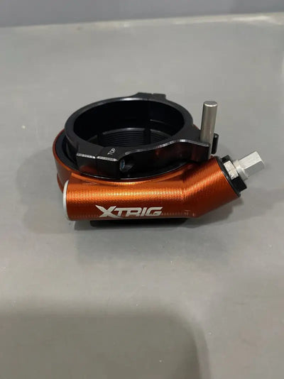 Orange and black XTRIG pre-load adjuster for motorcycle suspension, part number 500010100501